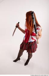 Tina STANDINGPOSE WITH DAGGER AND BASEBALL BAT 